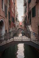 Scenic Bridge Over Canal in Venice, Italy with Unspecified Architectural Style and Surroundings photo