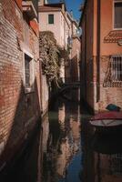 Canal with two gondolas in Venice, Italy. Architecture and landmarks of Venice. photo