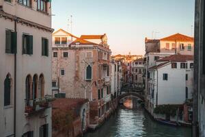 Scenic Canal View in Venice, Italy - Serene Waterway with Historic Architecture photo