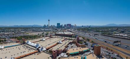 Aerial View of Las Vegas Cityscape with Stratosphere Tower Amidst Modern Architecture and Mountains photo