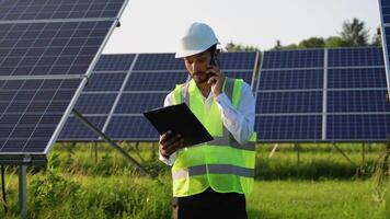 Solar energy, solar panels and electrician on a phone call networking, talking or speaking to a technician video