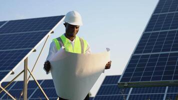 Young Black Engineers Open Drawing Blueprint Paper and Check Quality of Installing Solar Photovoltaic Panels video