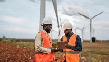 Engineers Using Digital Technology to Monitor Wind Turbine Maintenance.Generated image photo