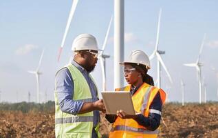 Engineers Using Digital Technology to Monitor Wind Turbine Maintenance.Generated image photo