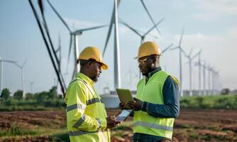 Engineers Using Digital Technology to Monitor Wind Turbine Maintenance.Generated image photo