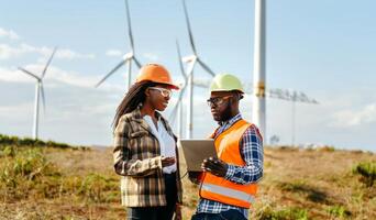 Engineers Using Digital Technology to Monitor Wind Turbine Maintenance.Generated image photo
