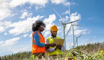 Engineers Using Digital Technology to Monitor Wind Turbine Maintenance.Generated image photo