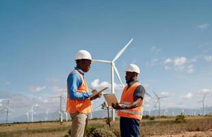 Engineers Using Digital Technology to Monitor Wind Turbine Maintenance.Generated image photo