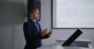 Genius Schoolboy In Classic Jacket Speaking In Classroom, Presenting Computer Science Project video