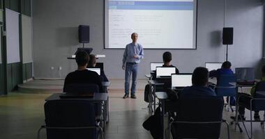 Programming Classes, Middle-Aged Professor Of Computer Science Teaching Young School Students video