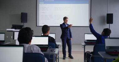 Classmates Discussing Project Of Smart Schoolboy In Classroom, Education In School For Programmers video
