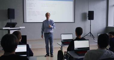 Middle-Aged Professor Of Computer Science And Programming Teaching Young School Students video