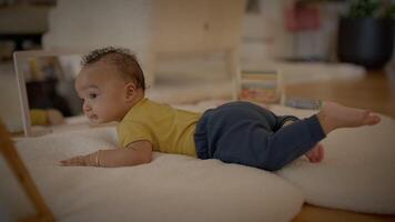 Enjoy watching your adorable baby during tummy time on a soft mat with a mirror video