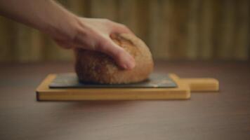 Wooden serving board with slate on rustic table is elegant and aesthetic for food presentation video