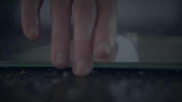 Captured in a minimalist style, an artistic photograph showcases a glass surface subtly illuminated video