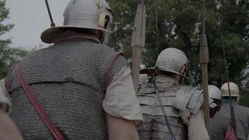 Witness a historical reenactment showcasing medieval soldiers in authentic armor on a battlefield video