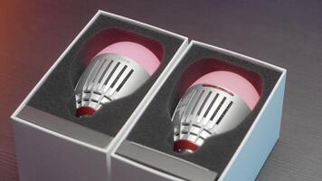 Close-up of LED light bulbs. Action. New light bulbs changing colors in boxes. New models of LED light bulbs to create atmosphere video