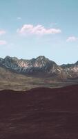 A scenic mountain range with billowing clouds in the sky video