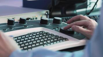 Keyboard with doctor's mouse. Stock footage. Modern medical keyboard with mouse for ultrasound fixation. Viewing with round mouse in medical examination video