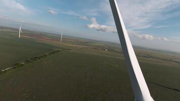 Beautiful green fields, drone view. Shot . A bright view of the helicopter wings and below you can see the landing pad. video