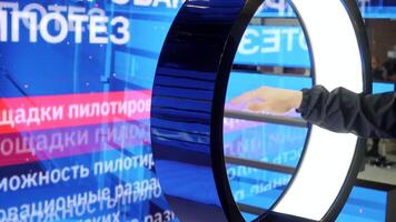 Close up of a male hand waving in front of a digital screen. Media. Modern computer screen with hand movement control. video