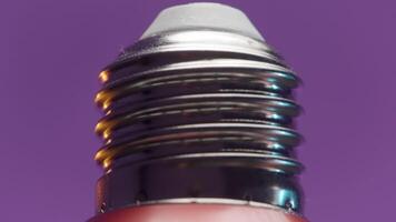 Close-up of light bulb on isolated background. Action. New LED light bulb for professional lighting. Technologies for creating lighting at photo shoots or at home video