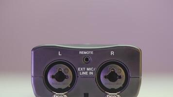 Close-up of portable voice recorder. Action. Details of modern voice recorder for recordings. New model of portable voice recorder on isolated background video