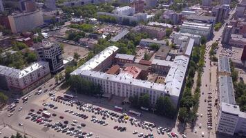 Top view of busy city on summer day. Clip. City with old beautiful architecture and moving cars. City with greenery and busy roads on sunny summer day video