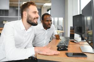 Two diverse crypto traders brokers stock exchange market investors discussing trading charts research reports growth using pc computer looking at screen analyzing invest strategy, financial risks photo