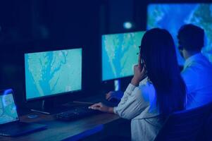 Diverse call center operators team use computers consulting clients in office photo