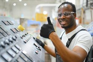 Portrait of industrial engineer. factory worker standing in factory production line photo