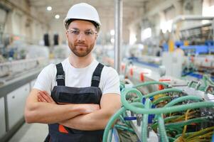 Factory worker. Man working on the production line photo