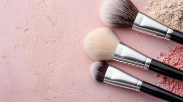 Makeup Brushes on Pink Background With Decorative Pearls photo