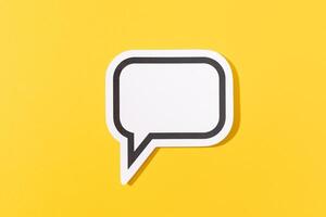 Blank Speech Bubble isolated on yellow background. Mock up template photo
