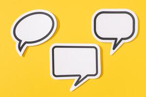 Group of three Blank Speech Bubble isolated on yellow background. Mock up template photo