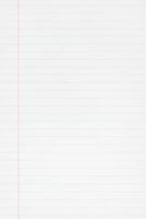 Blank lined paper background. Blue lines and red margin. Full frame photo