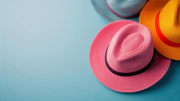 Colorful Straw Hats Arranged Neatly on a Blue Background photo