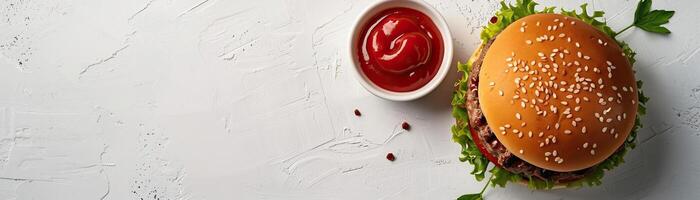 A minimalist, high-key setup with a beef burger beside a small bowl of ketchup, set against a crisp, white background, broad empty space on the right for promotional text. photo