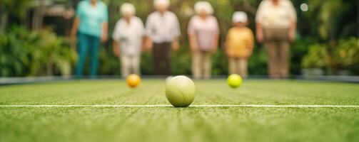 Elderly group enjoying a game of lawn bowls, bright and lively atmosphere, fun physical activity, wellness concept, empty copy space on the right photo