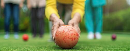 Elderly group enjoying a game of lawn bowls, bright and lively atmosphere, fun physical activity, wellness concept, empty copy space on the right photo