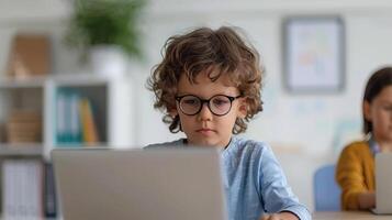 Kid using a laptop for study at a desk, modern education concept, editorial photography, empty copy space for text photo
