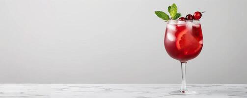 A sophisticated Cranberry Sangria in a sleek photo