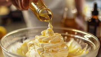 Closeup of lemon extract being added to a dessert. photo