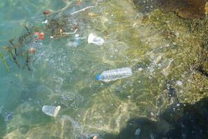 plastic waste on the beach, closeup of photo with soft focus
