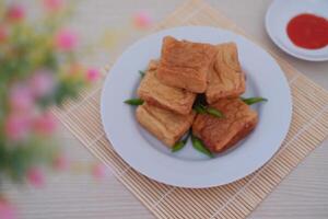 Tahu Bakso, Indonesian traditional snack made from tofu and beef. Served in white plate. photo