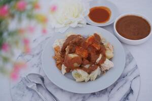 Siomay, Indonesian traditional street food with spicy peanut sauce photo