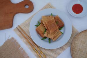 Tahu Bakso, Indonesian traditional snack made from tofu and beef. Served in white plate. photo