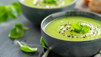 Fresh Green Basil Soup With Cream and Herbs in a Cozy Kitchen Setting photo