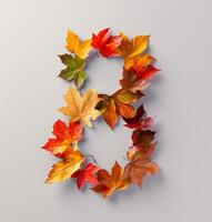 Colorful Autumn Leaves Formed Into the Number Eight on White Background photo