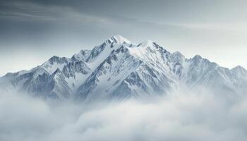 Snow-Capped Mountains Amidst Fog in Early Morning Light photo